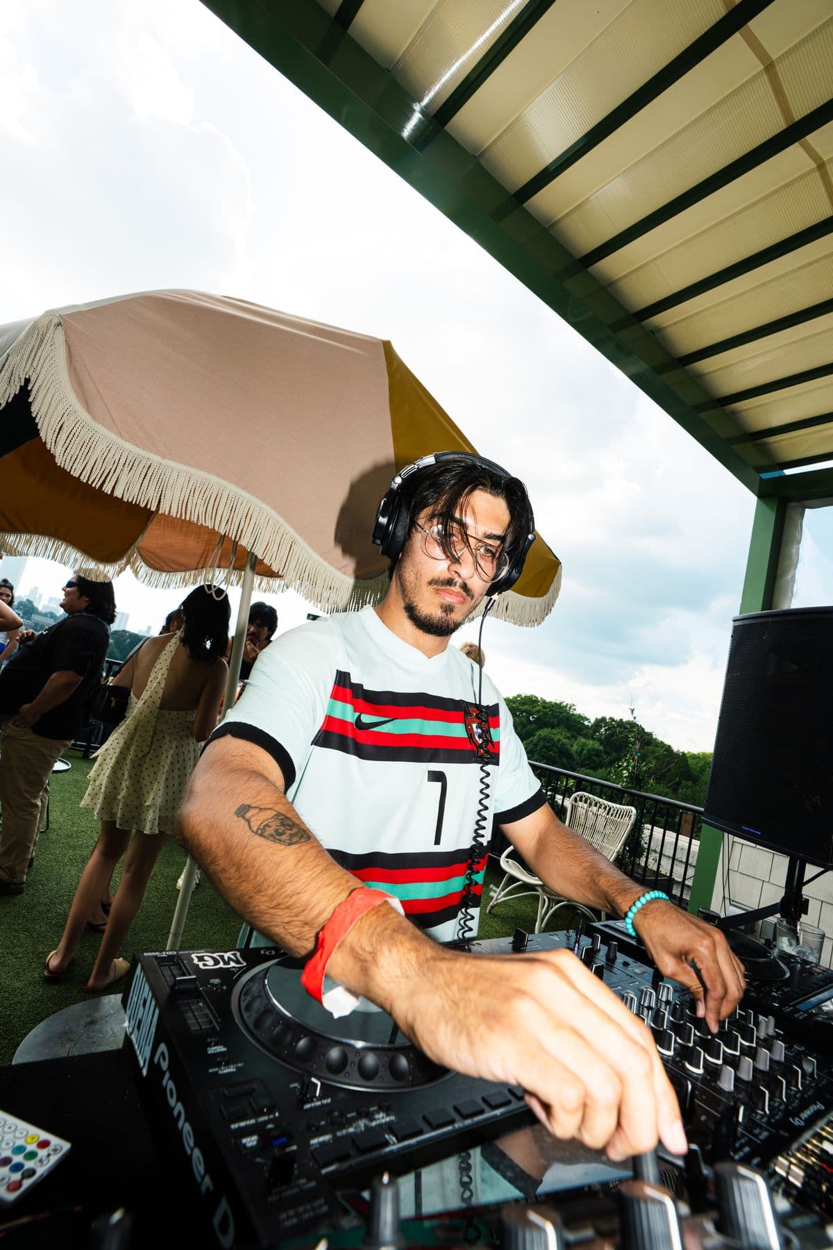 Jason Davila mixing on the roof in the afternoon sun